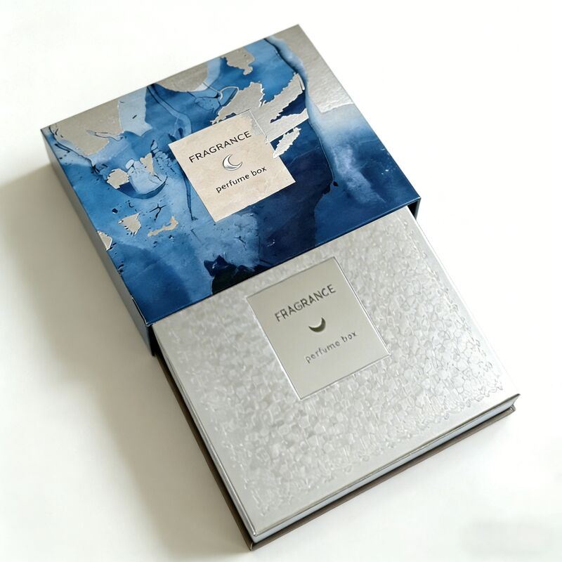 Caja de regalo de perfume con logotipo personalizado y estampado de lámina plateada en cartón certificado FSC de 350 g/m² para embalaje de fragancias de lujo
