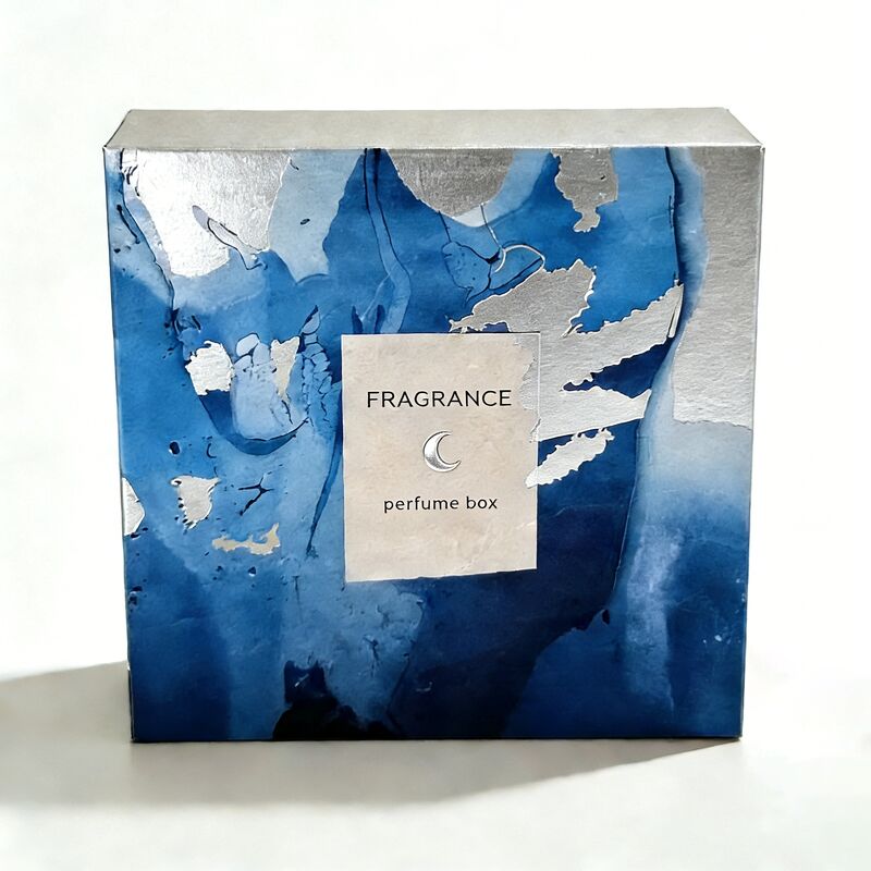 Caja de regalo de perfume con logotipo personalizado y estampado de lámina plateada en cartón certificado FSC de 350 g/m² para embalaje de fragancias de lujo